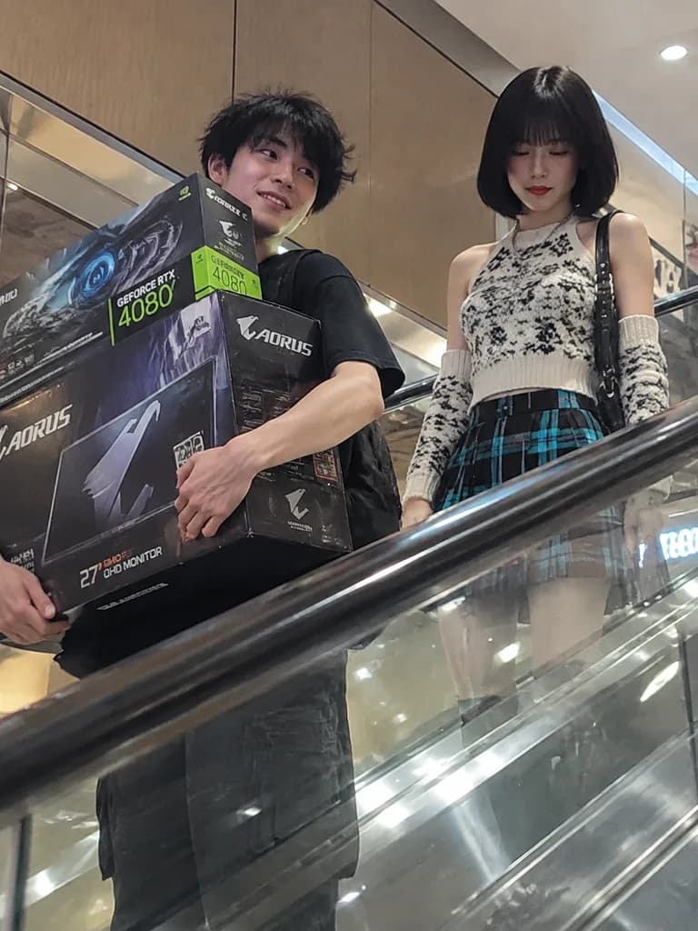 Candid Tech Shoppers on Mall Escalator