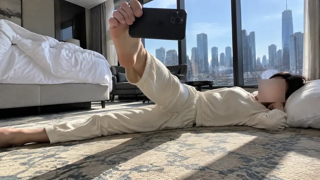 Floor-Level Foot Selfie in Hotel Room