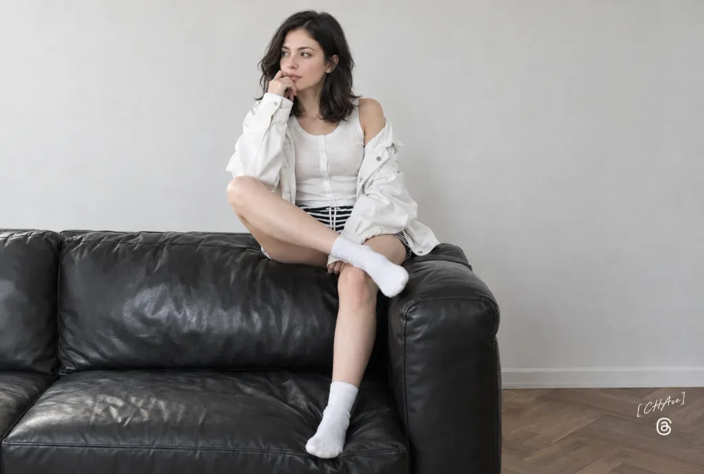 Minimalist Studio Portrait on Leather Sofa